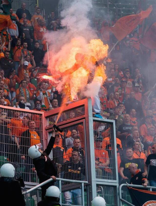 Illustration for article titled Crazy Photo: Soccer Fan Goes Up In Flames